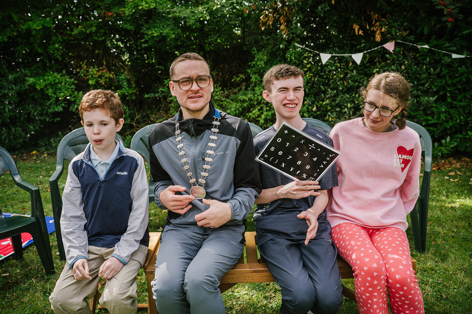 Spellers gathered together at a Spelling Alliance of Ireland event, with a communication board visible.